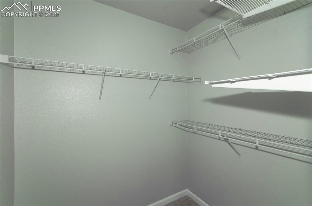 9443 St.George Road Peyton, CO 80831 - Photo 38 of 45 a view of a room with racks on the wall