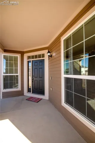 a view of an empty room with a large window