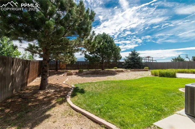 a view of backyard with green space