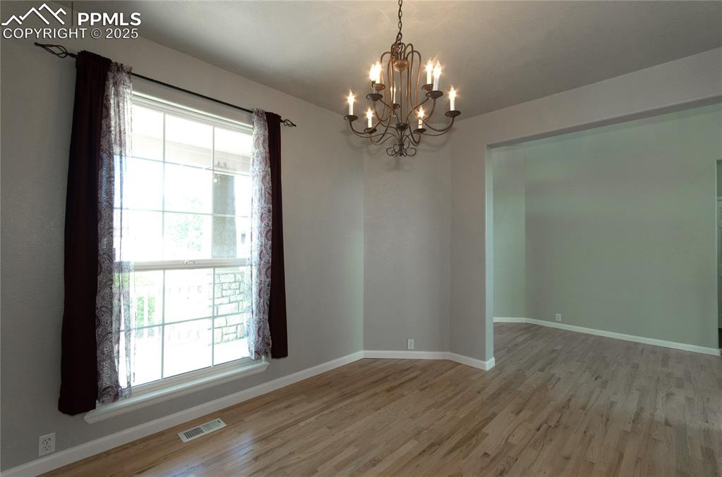 9443 St.George Road Peyton, CO 80831 - Photo 6 of 45 wooden floor in an empty room with a window