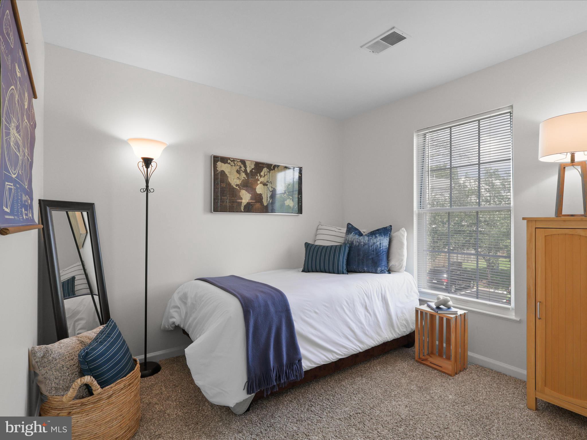 25449 Morse Drive Chantilly, VA 20152 - Photo 19 of 46 a bedroom with a bed and wooden floor