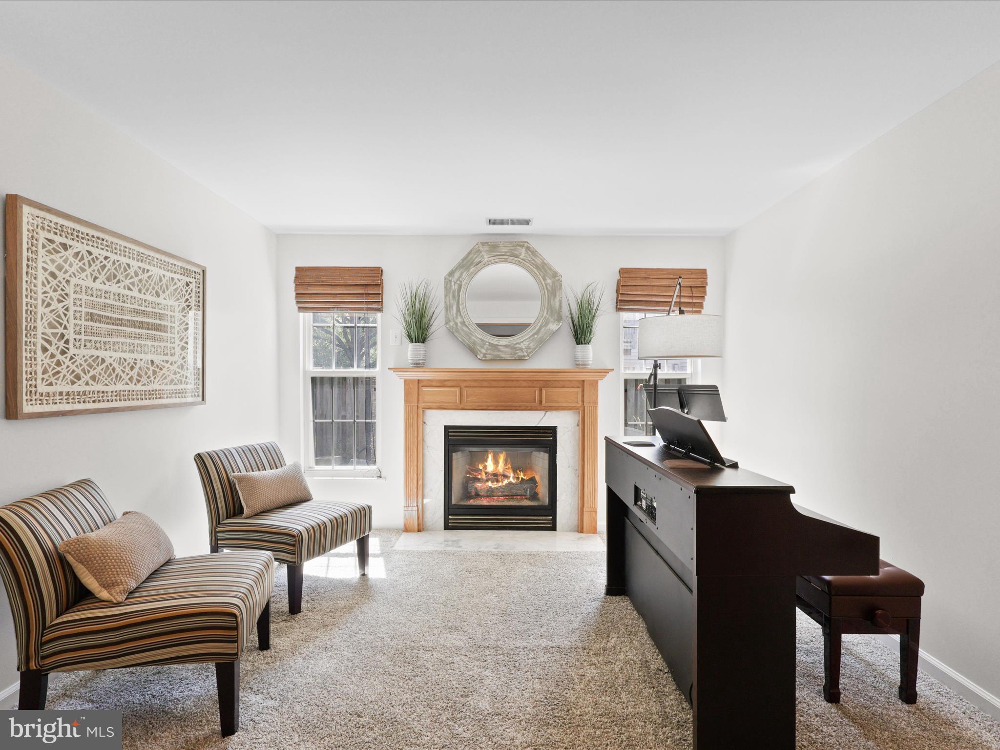 25449 Morse Drive Chantilly, VA 20152 - Photo 27 of 46 a living room with furniture and a fireplace