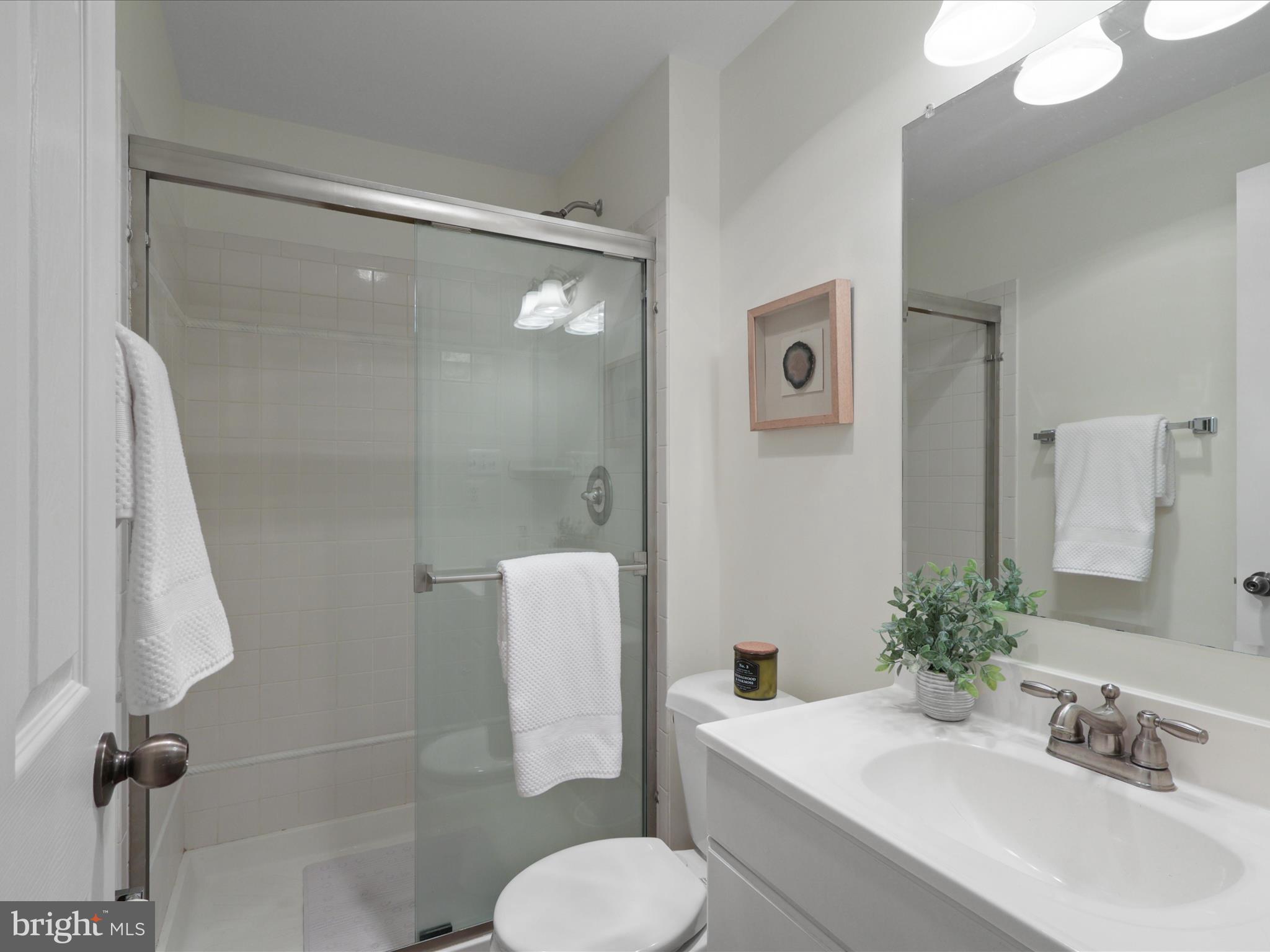 25449 Morse Drive Chantilly, VA 20152 - Photo 30 of 46 a bathroom with a sink toilet and shower