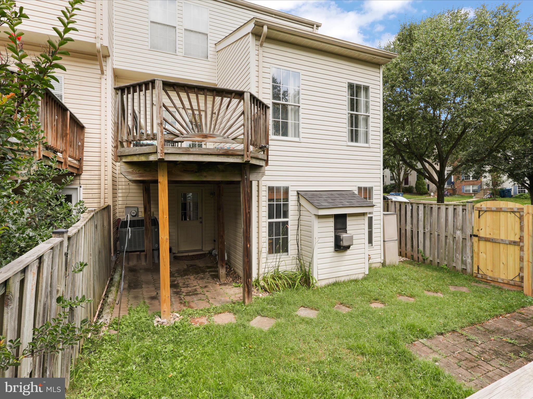 25449 Morse Drive Chantilly, VA 20152 - Photo 31 of 46 a view of a house with wooden walls and a fence