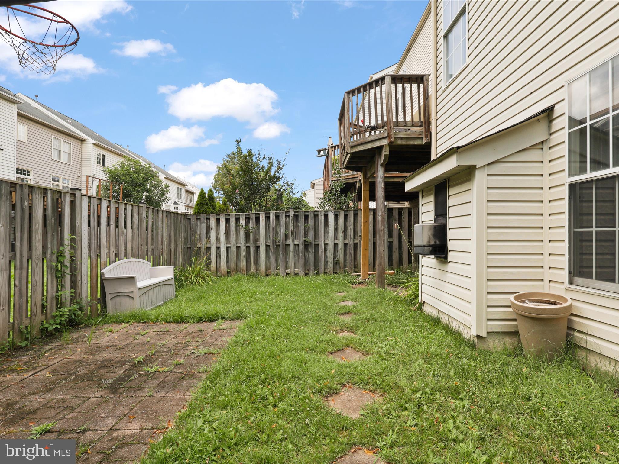 25449 Morse Drive Chantilly, VA 20152 - Photo 32 of 46 a view of a chair and table in the backyard