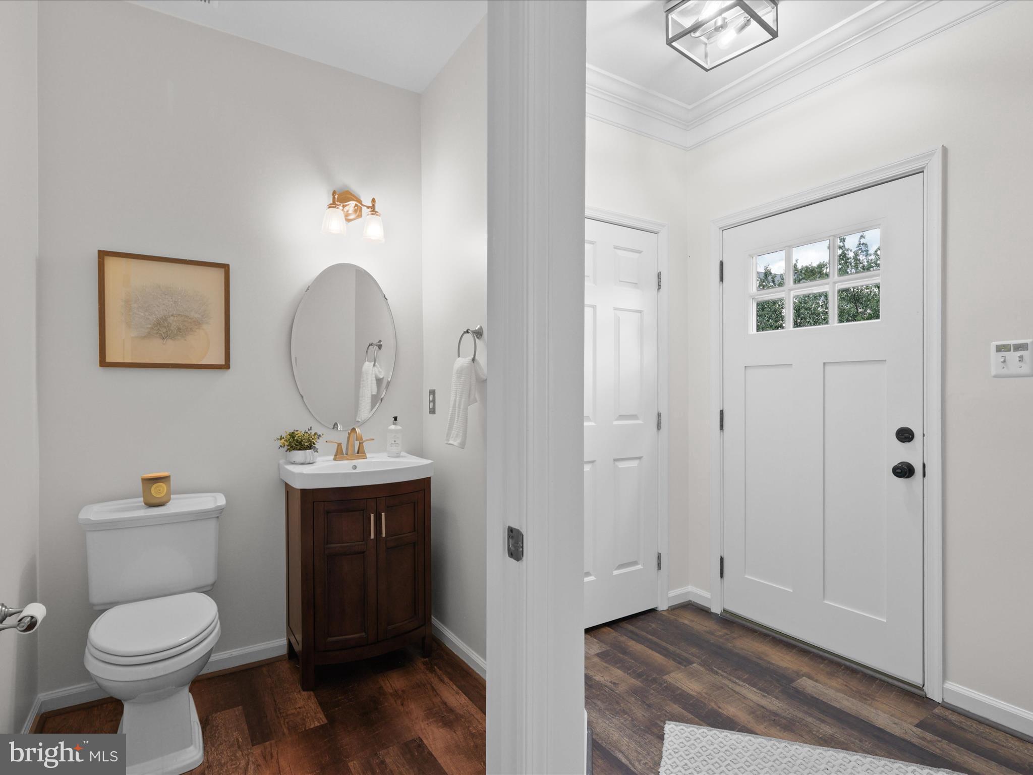 25449 Morse Drive Chantilly, VA 20152 - Photo 5 of 46 a bathroom with a toilet sink and mirror