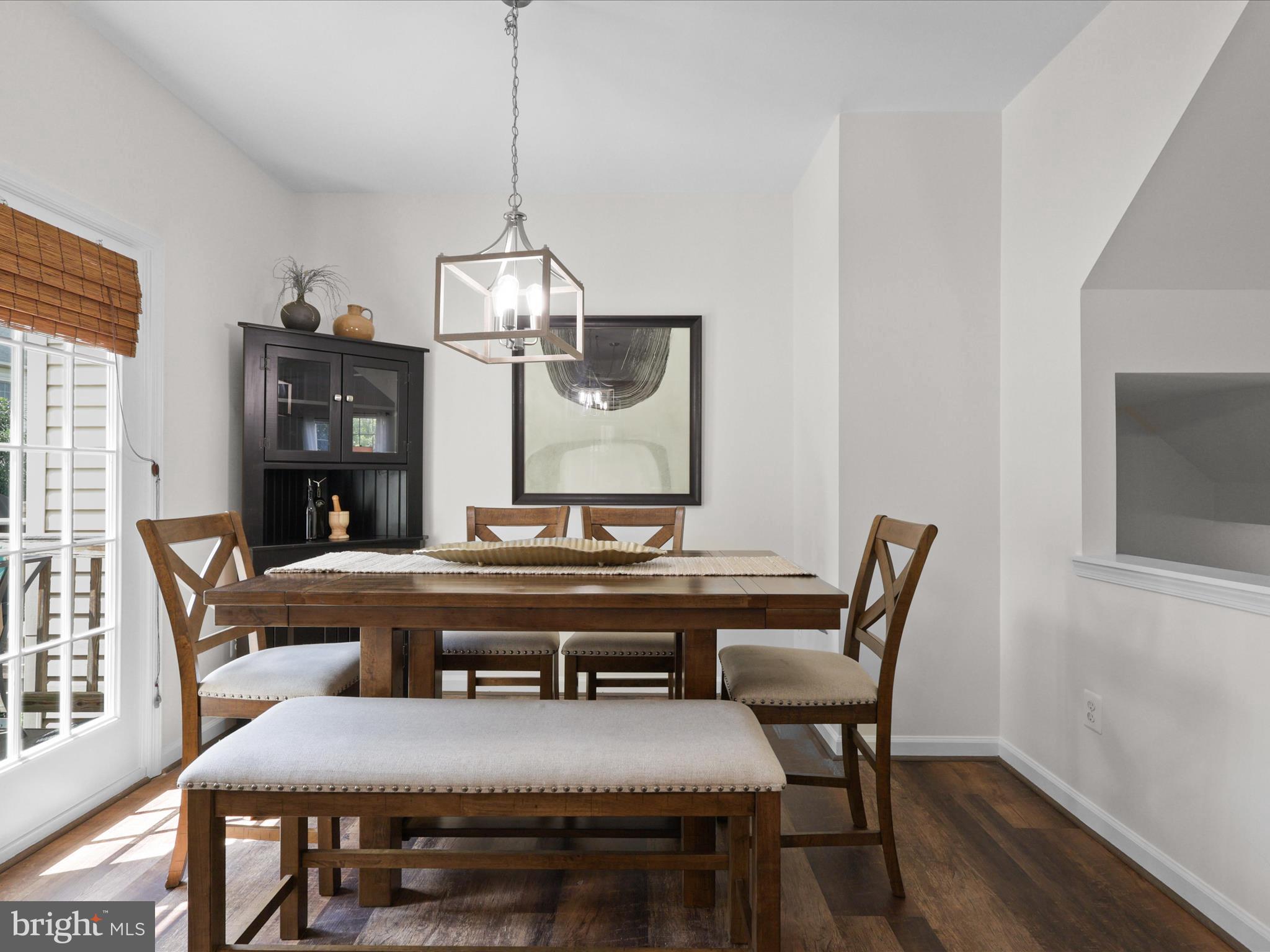 25449 Morse Drive Chantilly, VA 20152 - Photo 7 of 46 a view of a dining room with furniture wooden floor and chandelier