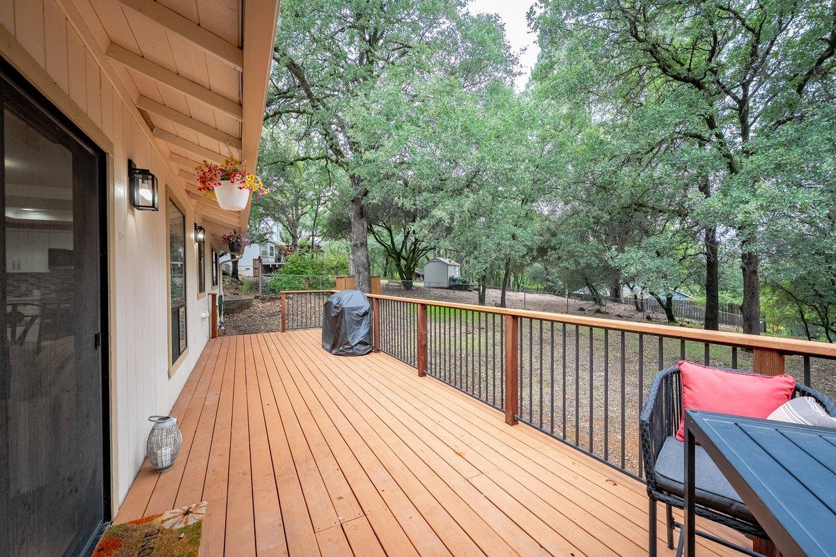 6561 Trinity Way Placerville, CA 95667 - Photo 38 of 58 a view of a roof deck with wooden floor and fence