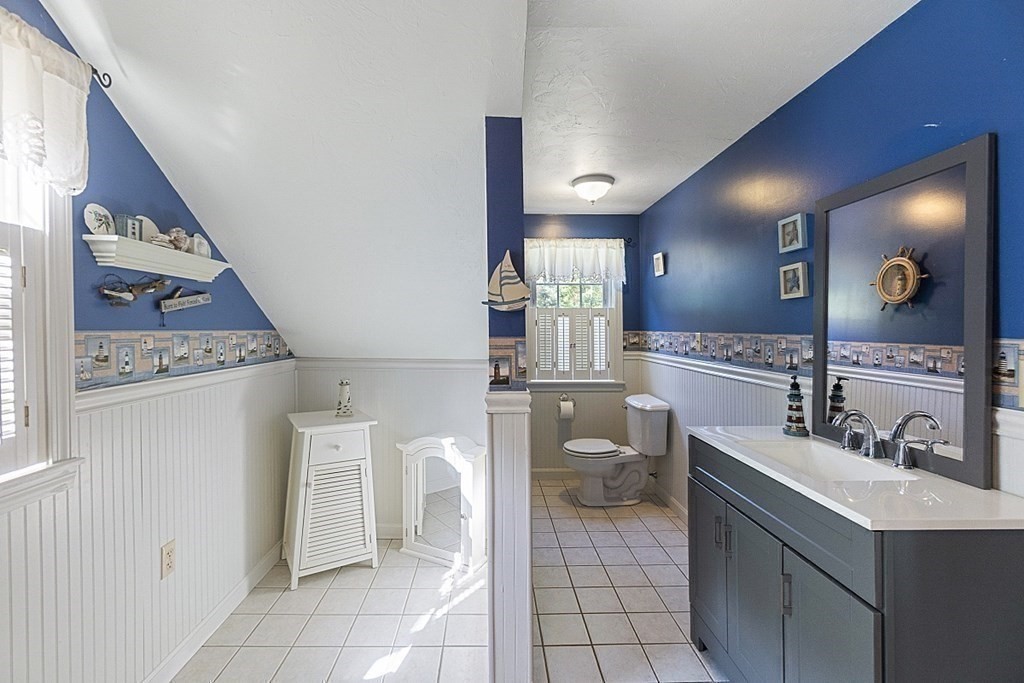 45 Walker Road Ware, MA 01082 - Photo 23 of 42 a bathroom with a toilet sink and mirror