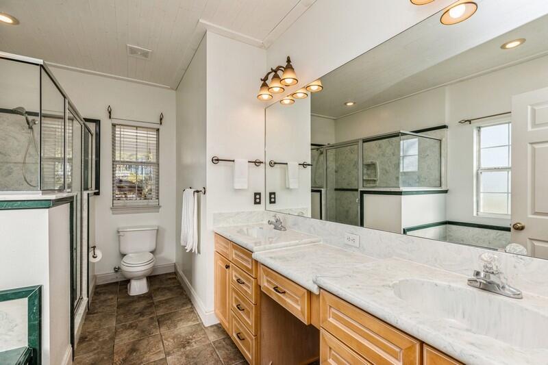 1510 Vinson Ray Road Baker, FL 32531 - Photo 29 of 60 a spacious bathroom with a granite countertop sink a toilet a mirror and shower