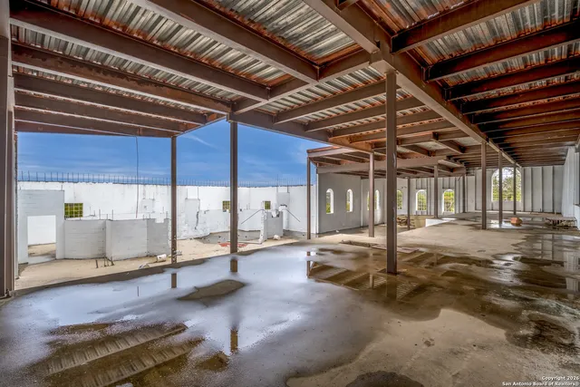 a view of a room with wooden ceiling