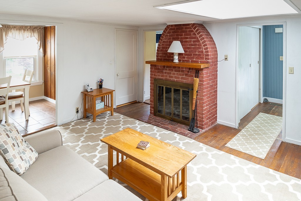 32 Bayview Road Marblehead, MA 01945 - Photo 3 of 12 a living room with furniture and a fireplace