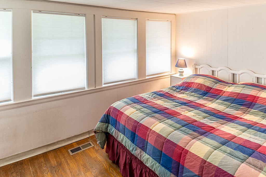 32 Bayview Road Marblehead, MA 01945 - Photo 7 of 12 a bedroom with a bed and a window
