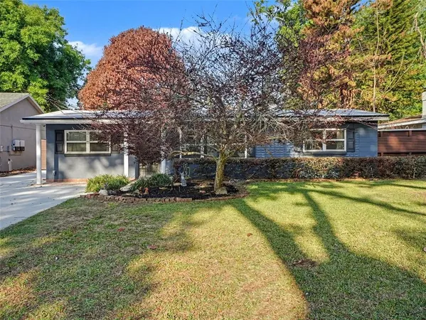 a view of a house with swimming pool and porch