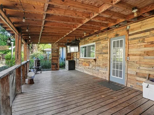 a view of a patio with wooden floor