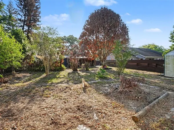 a backyard of a house with lots of green space
