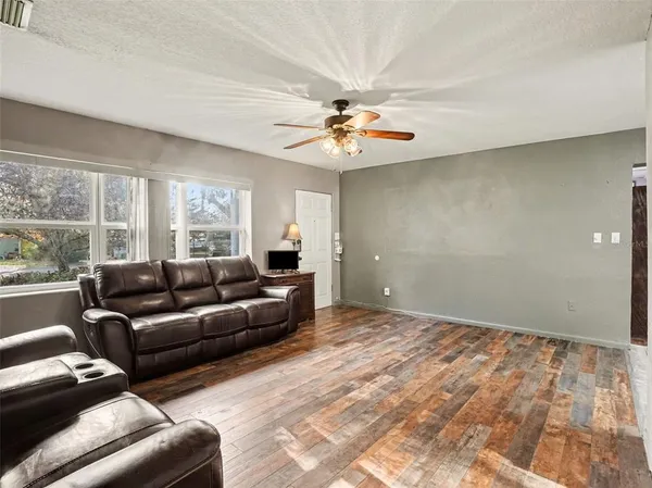 a living room with furniture and a large window