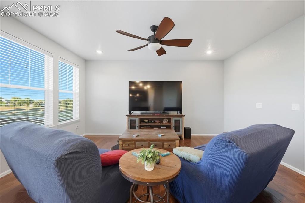 10539 Casper Point Parker, CO 80134 - Photo 12 of 35 Living area with wood finished floors, a ceiling fan, and recessed lighting