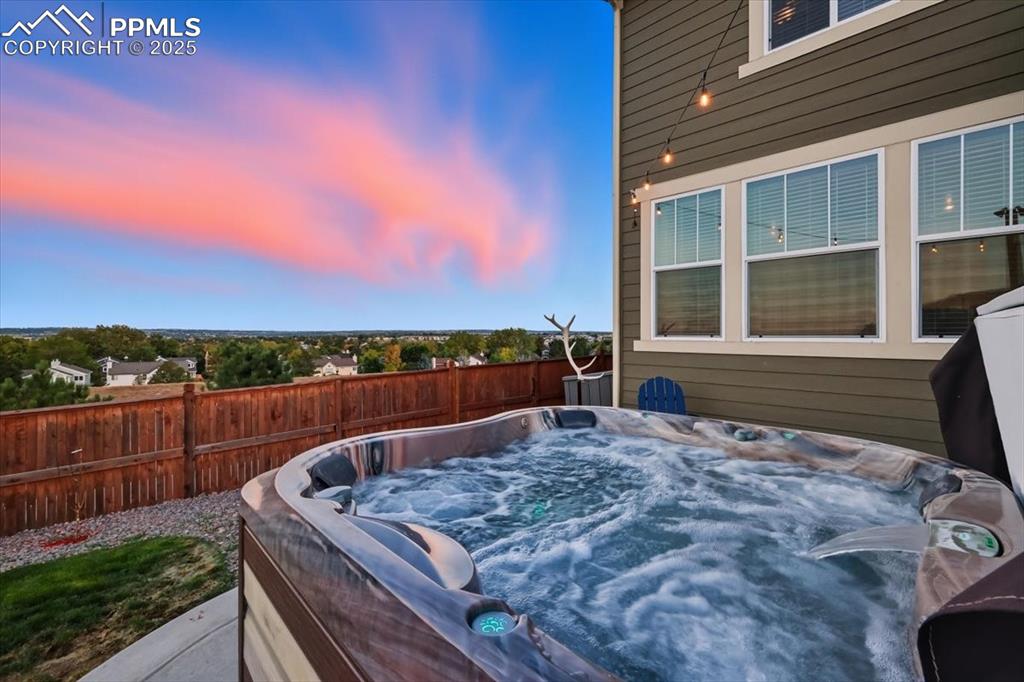 10539 Casper Point Parker, CO 80134 - Photo 24 of 35 Deck at dusk featuring a hot tub