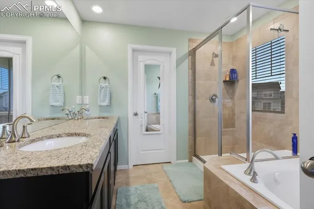 a bathroom with a granite countertop sink shower and a mirror