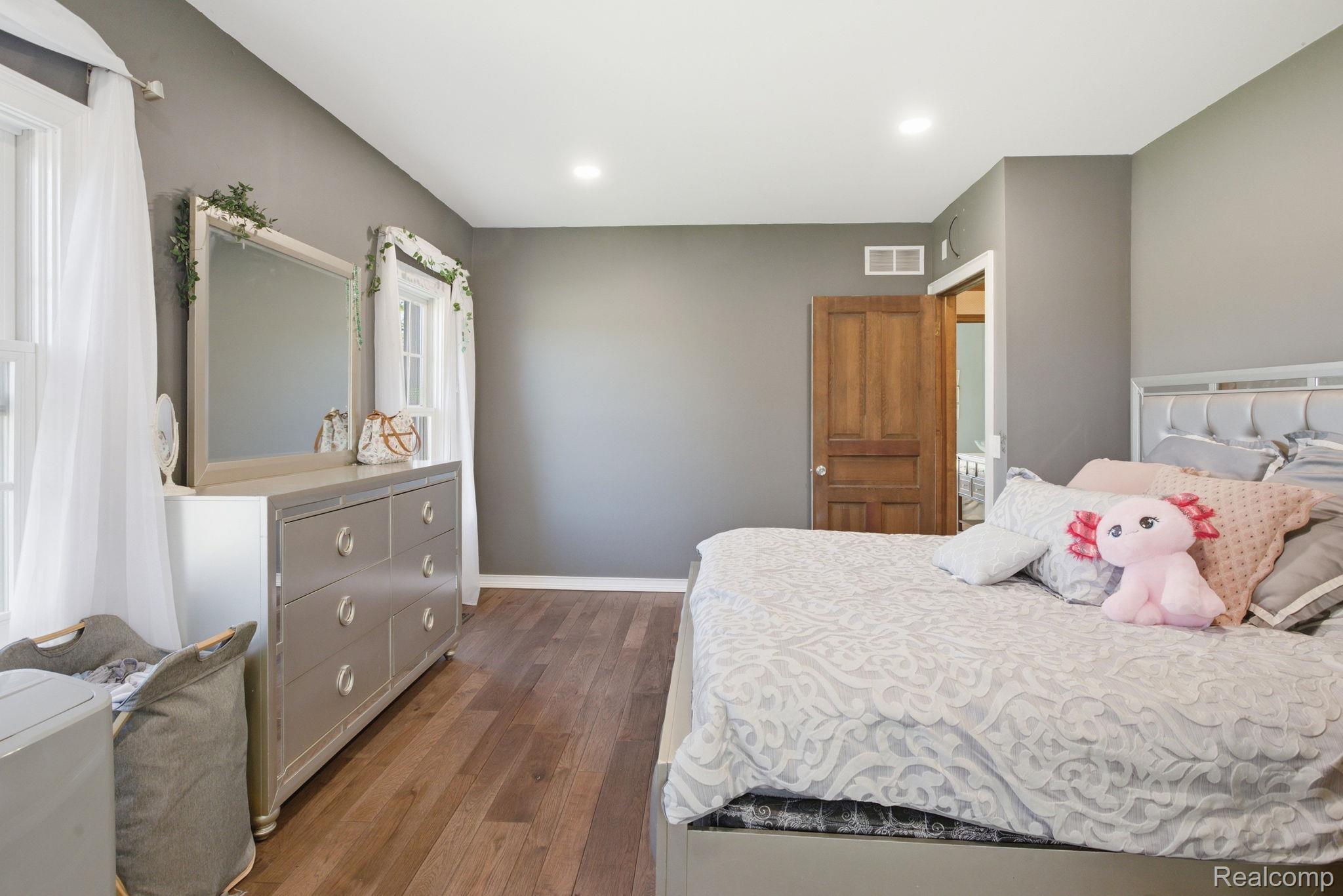 14104 Carleton West Road Carleton, MI 48117 - Photo 32 of 58 Bedroom featuring dark wood-type flooring and recessed lighting