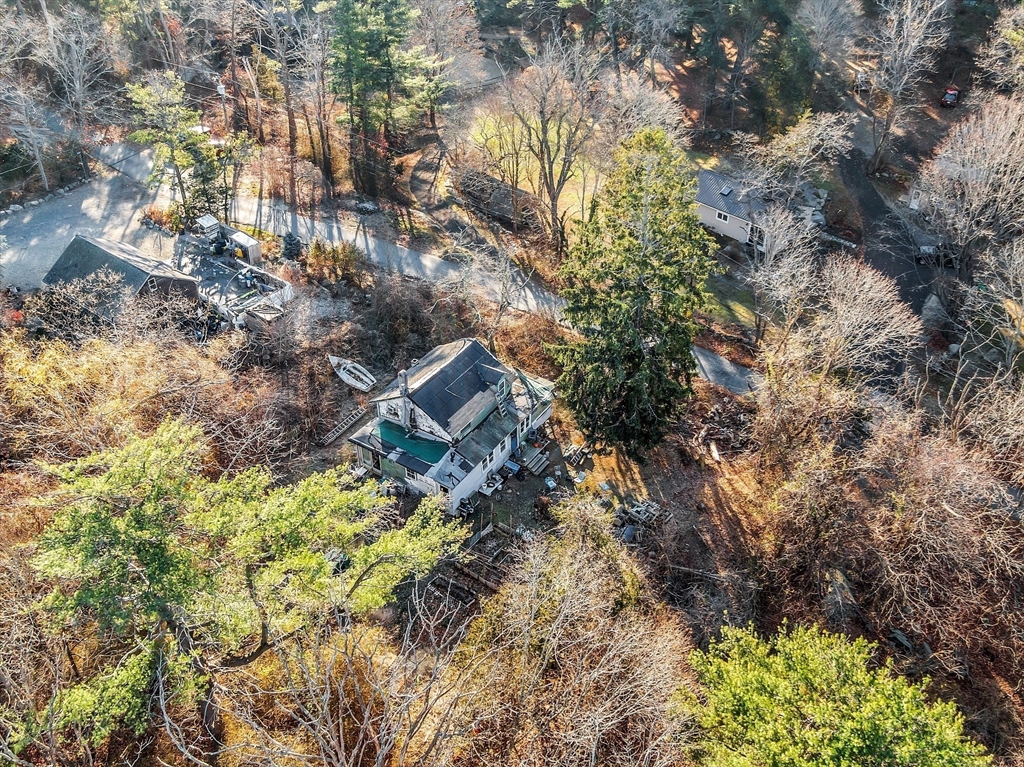 2 Great Hill Road Gloucester, MA 01930 - Photo 4 of 11 a backyard of a house with large trees