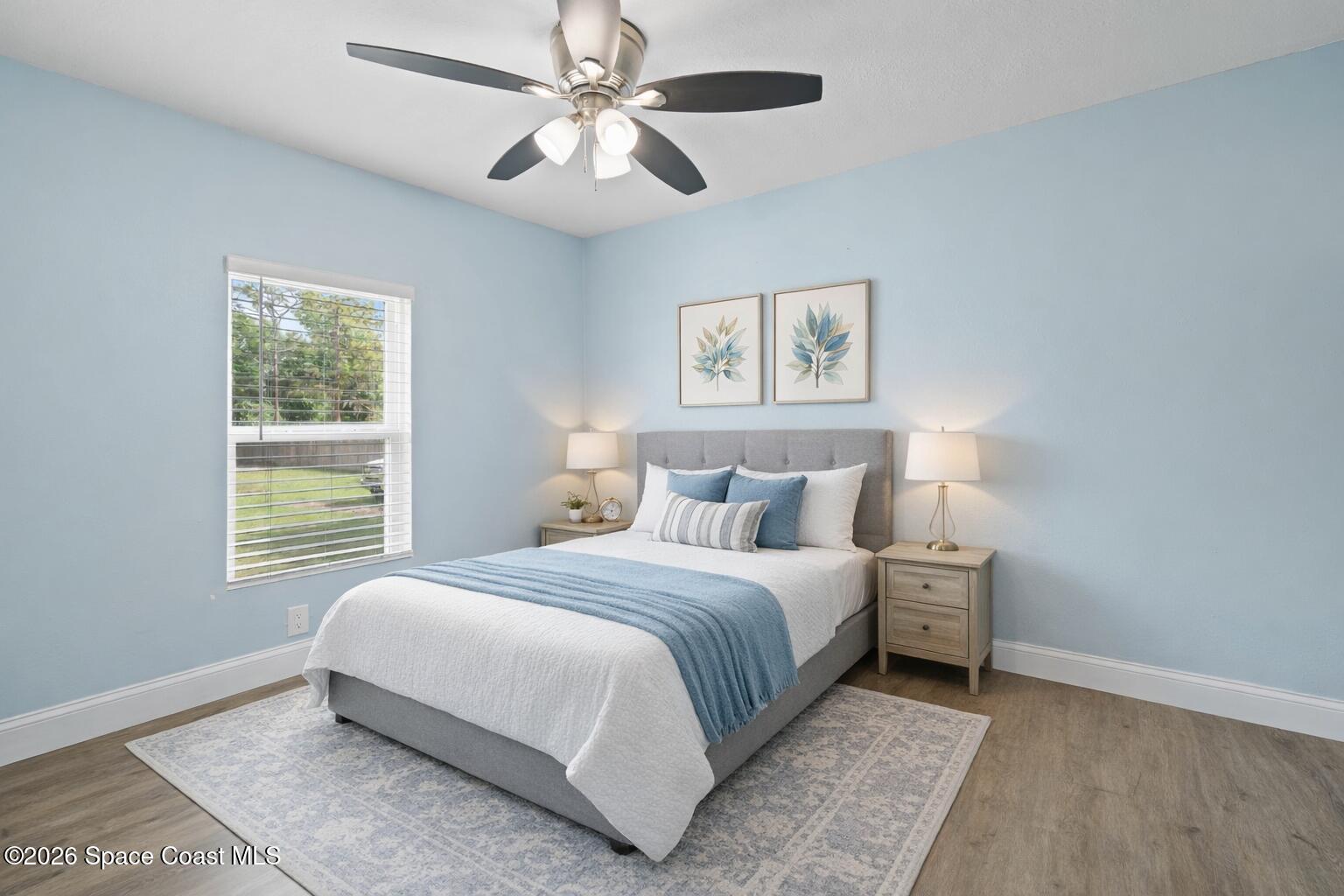 9025 Lincoln Road St. Cloud, FL 34773 - Photo 13 of 53 Serene bedroom with soft blue accents