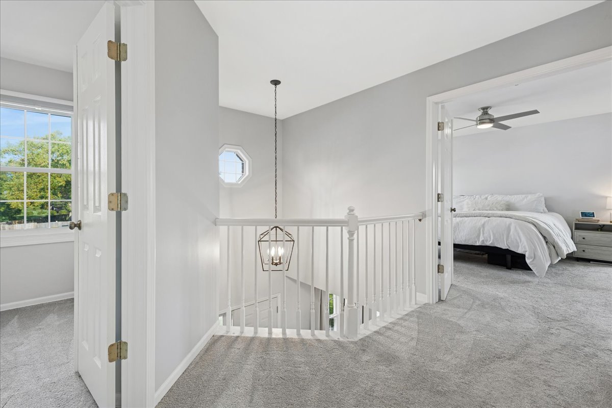 2 Daybreak Ridge Trail Cary, IL 60013 - Photo 16 of 37 a view of a room with a large window and chandelier