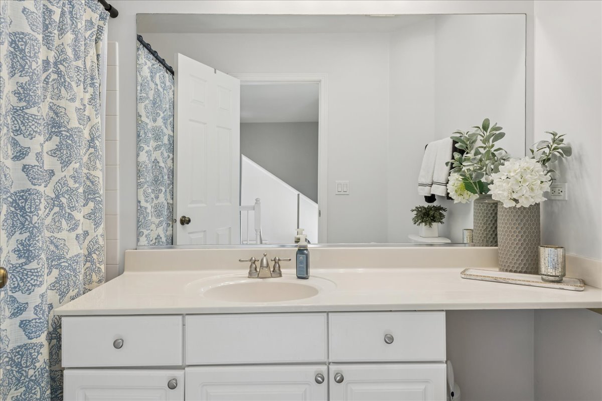 2 Daybreak Ridge Trail Cary, IL 60013 - Photo 22 of 37 a bathroom with a sink and a mirror