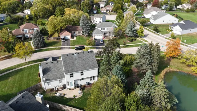 an aerial view of residential houses with outdoor space