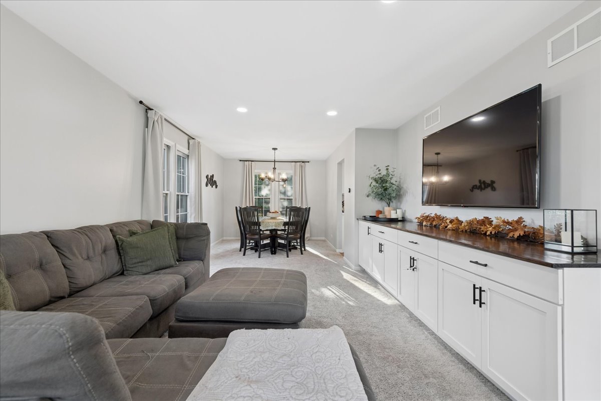 2 Daybreak Ridge Trail Cary, IL 60013 - Photo 4 of 37 a living room with furniture and a flat screen tv