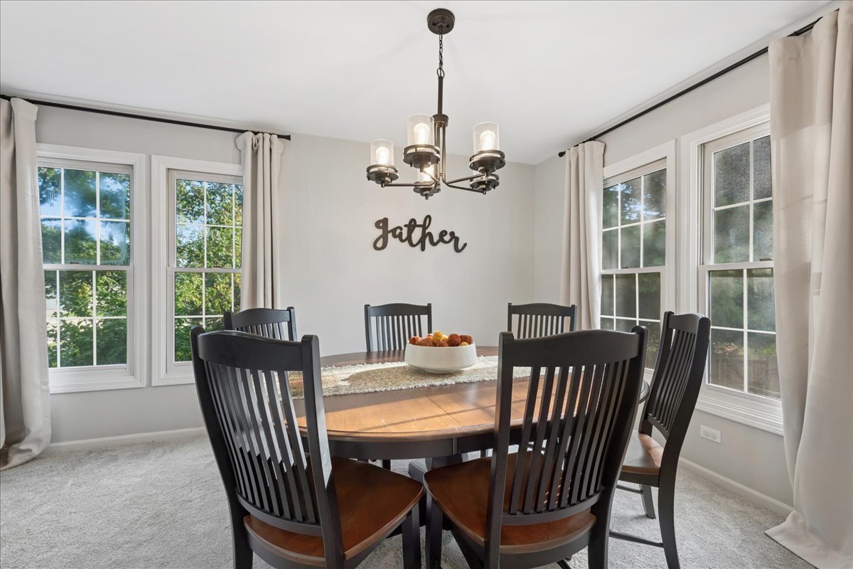 2 Daybreak Ridge Trail Cary, IL 60013 - Photo 5 of 37 a view of a dining room with furniture window and outside view