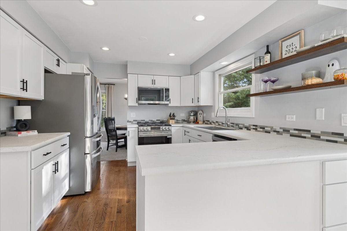 2 Daybreak Ridge Trail Cary, IL 60013 - Photo 7 of 37 a kitchen with stainless steel appliances a refrigerator stove and sink