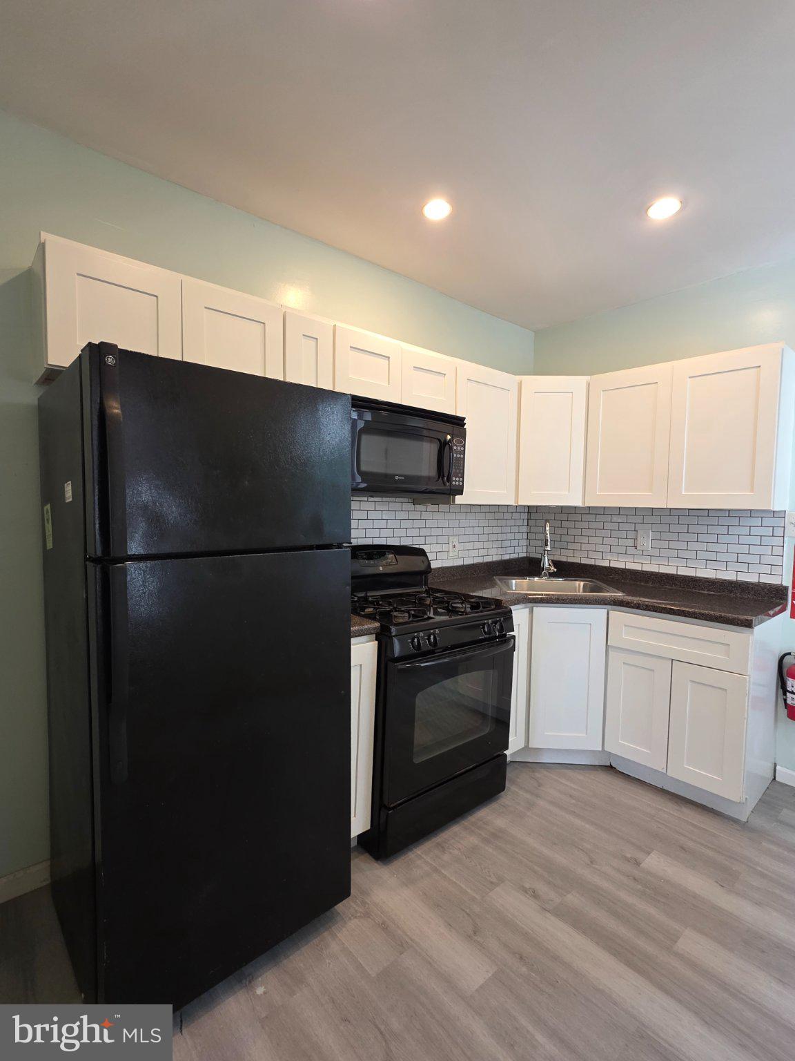 1864 North Uber Street Philadelphia, PA 19121 - Photo 6 of 29 Modern kitchen with sleek finishes.