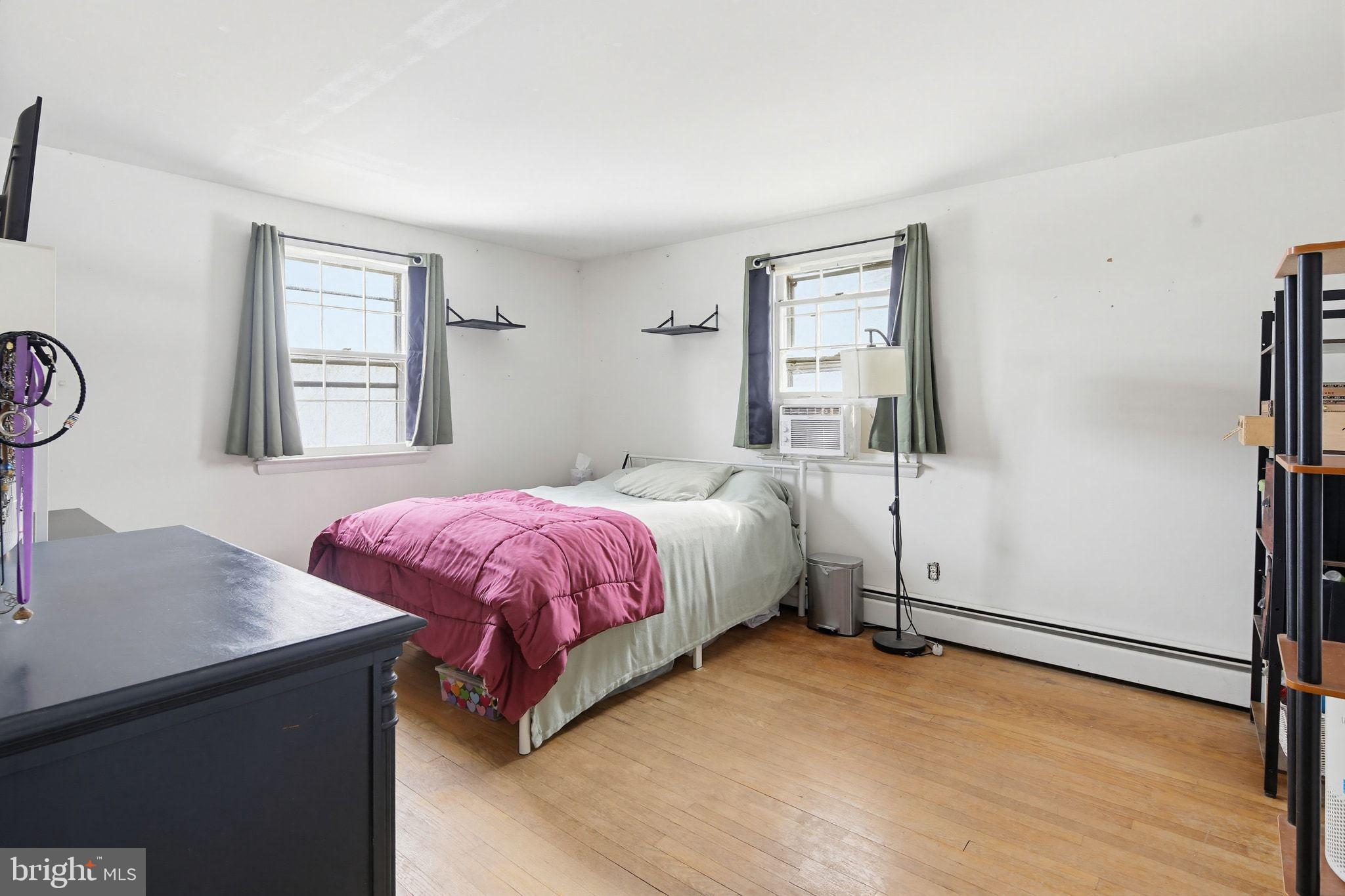 2124 Oaklyn Drive Fallston, MD 21047 - Photo 18 of 33 a spacious bedroom with a bed and a table in it