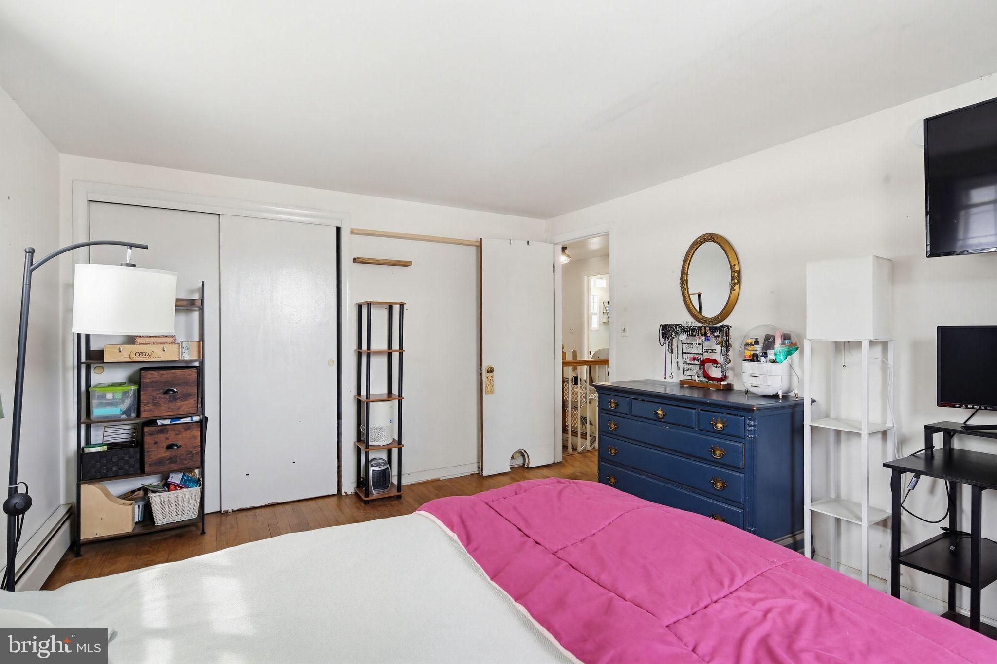 2124 Oaklyn Drive Fallston, MD 21047 - Photo 19 of 33 a bedroom with a bed and a flat tv screen on dresser