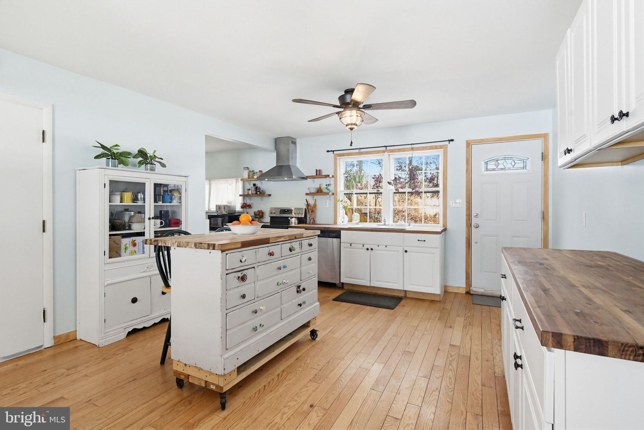 2124 Oaklyn Drive Fallston, MD 21047 - Photo 3 of 33 a kitchen with stainless steel appliances a stove a window and white cabinets