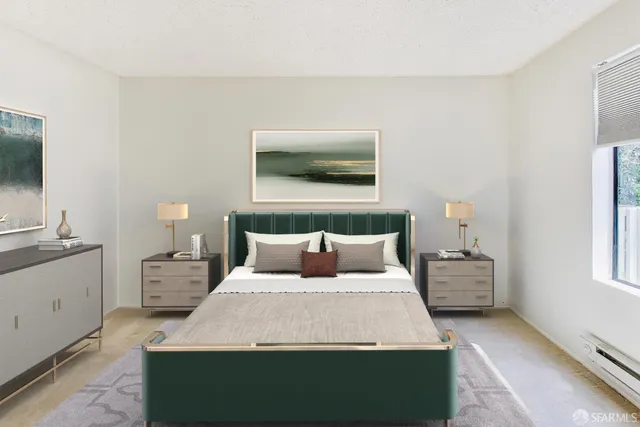 a bedroom with a large bed and a flat screen tv