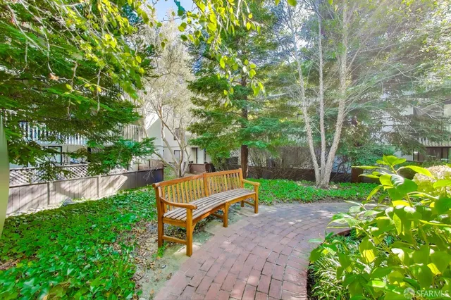 a park with a bench and trees