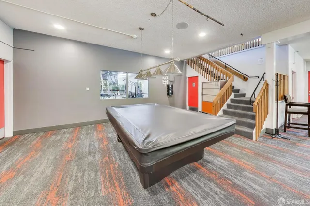 a room with lots of furniture and wooden floors