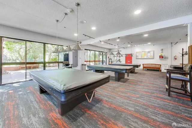 a view of swimming pool with outdoor seating