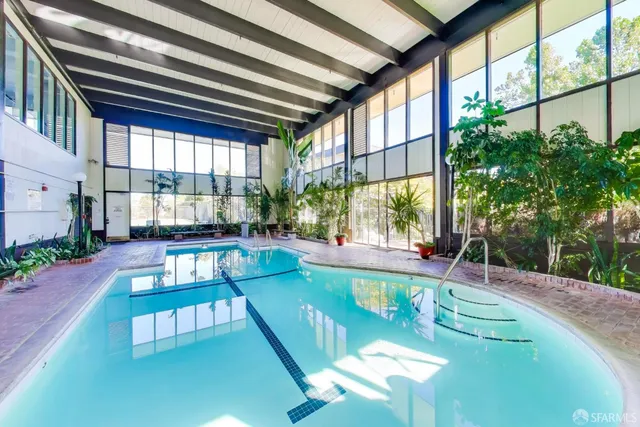 a view of swimming pool with a patio