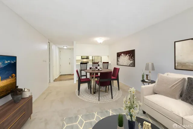 a dining room with furniture and window