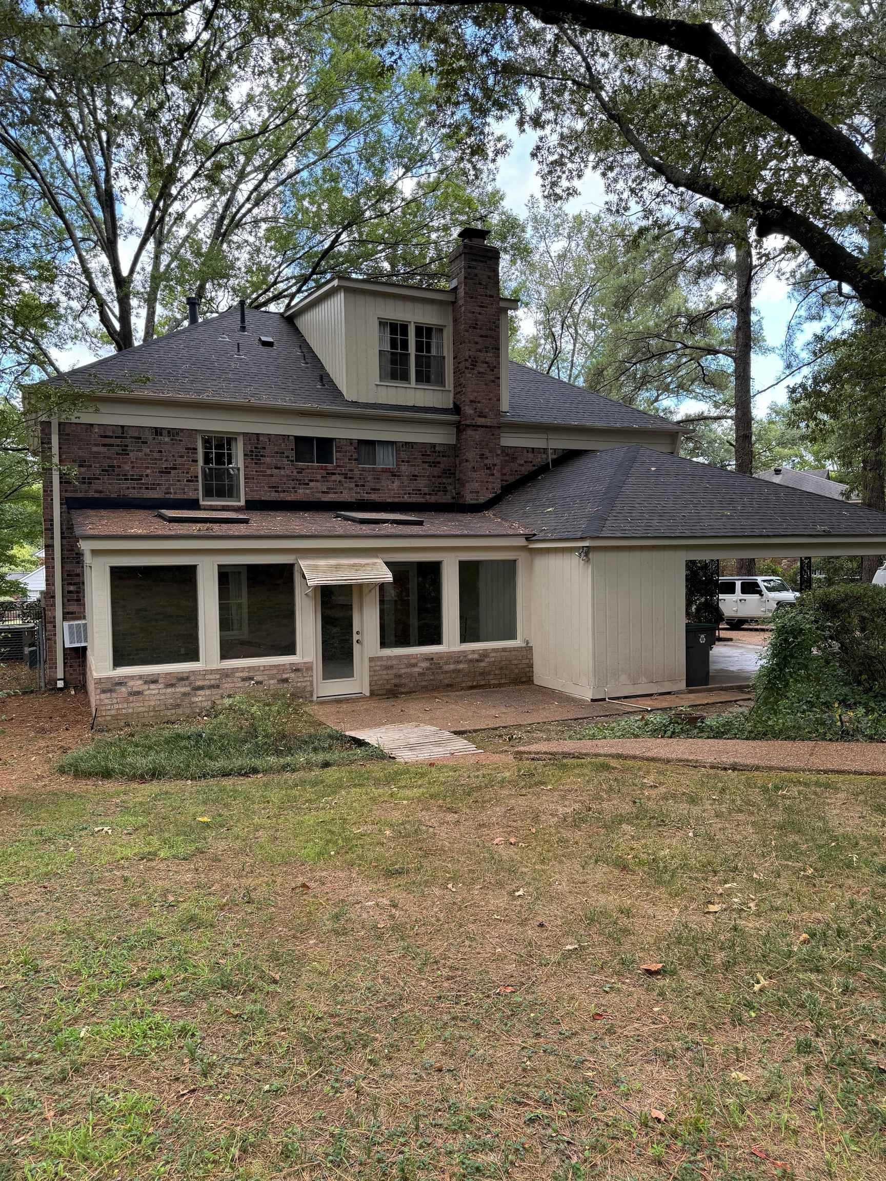 6738 River Birch Road Memphis, TN 38119 - Photo 15 of 17 Back of property with a patio area and a yard