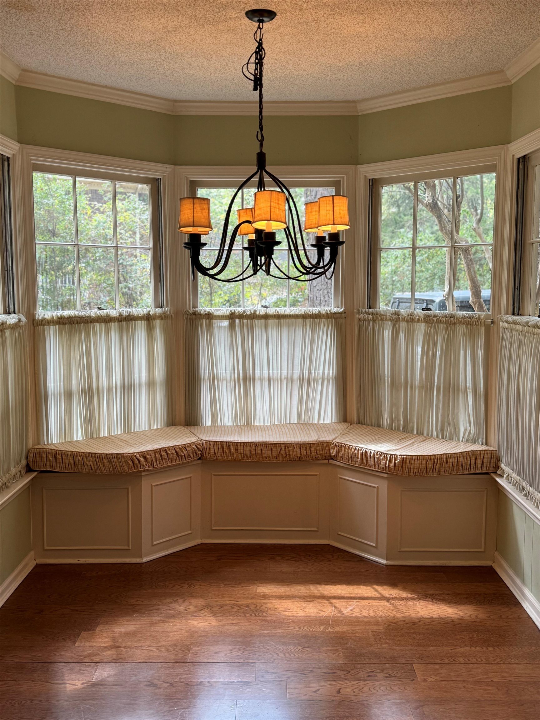 6738 River Birch Road Memphis, TN 38119 - Photo 5 of 17 Unfurnished dining area featuring wood-type flooring, plenty of natural light, and a textured ceiling
