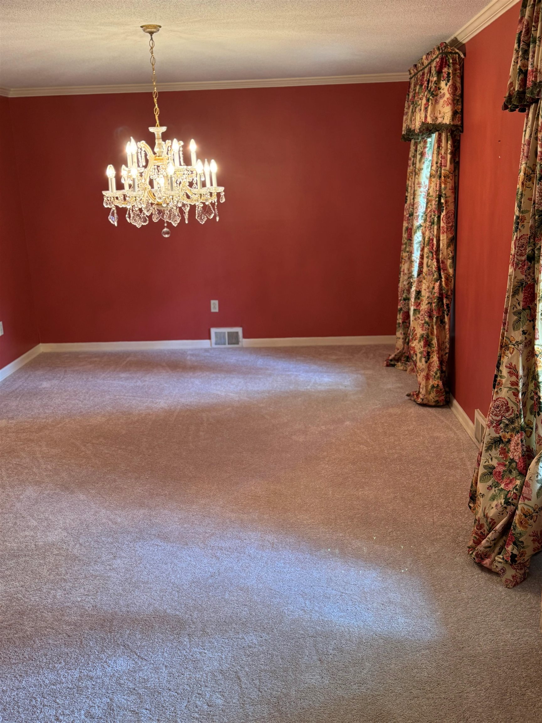 6738 River Birch Road Memphis, TN 38119 - Photo 7 of 17 Spare room with carpet flooring, an inviting chandelier, crown molding, and a textured ceiling