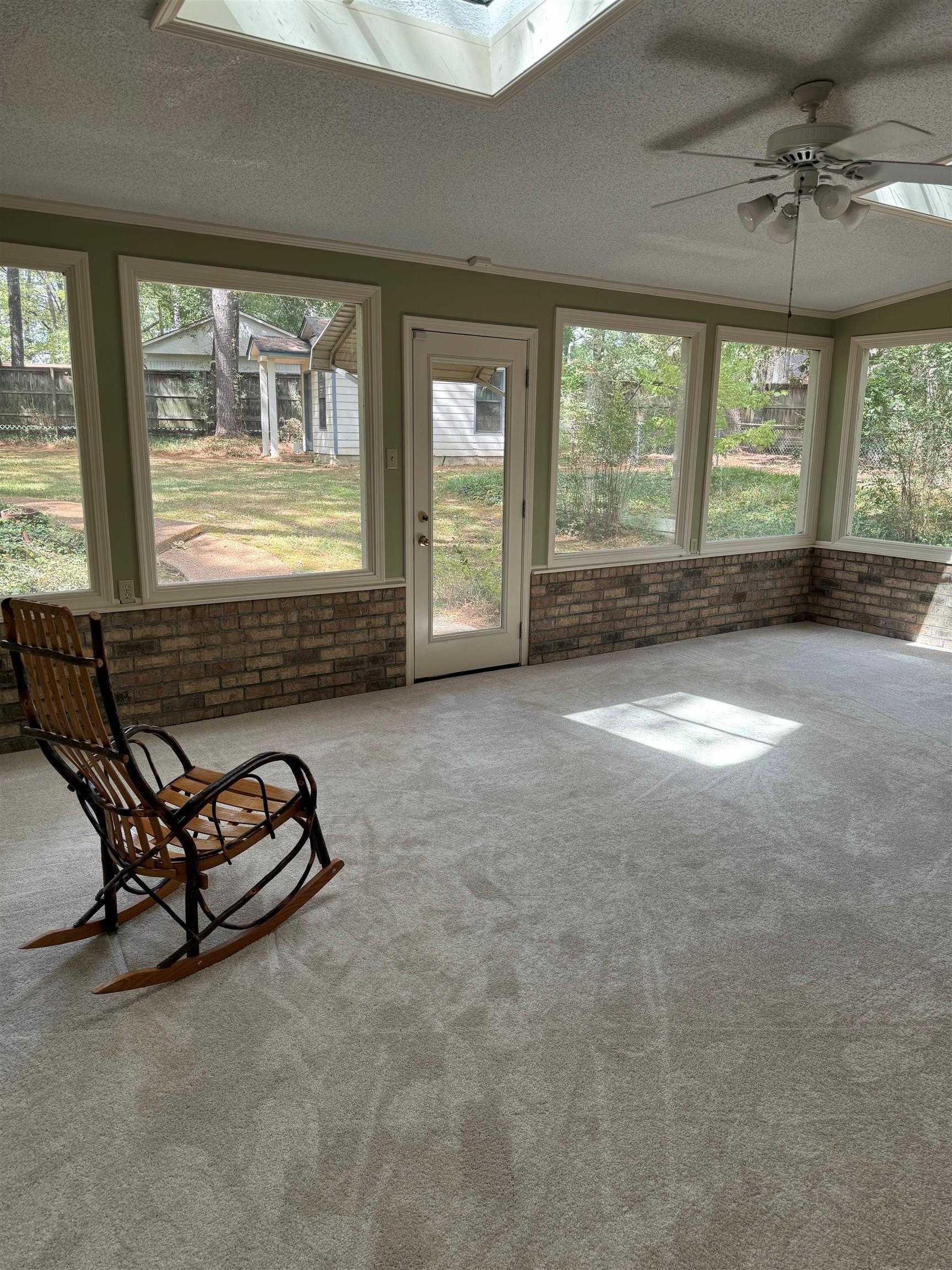 6738 River Birch Road Memphis, TN 38119 - Photo 9 of 17 Unfurnished sunroom with ceiling fan