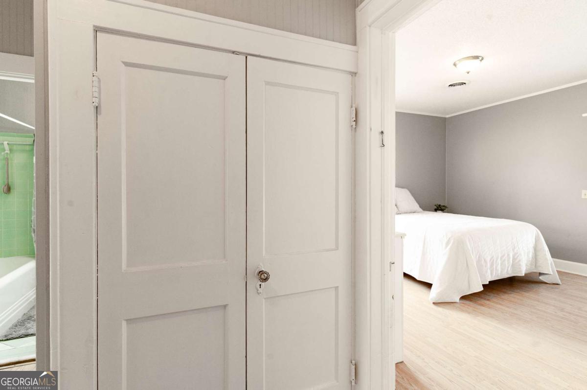 316 Fair Street Baxley, GA 31513 - Photo 22 of 64 a bedroom with a bed and a walk in closet