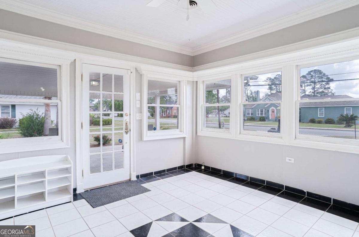 316 Fair Street Baxley, GA 31513 - Photo 37 of 64 a view of empty room with windows