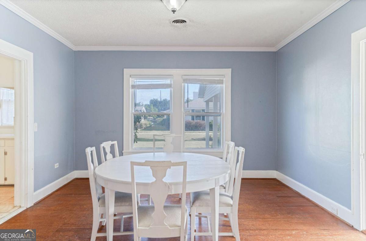 316 Fair Street Baxley, GA 31513 - Photo 4 of 64 a dining room with furniture and wooden floor